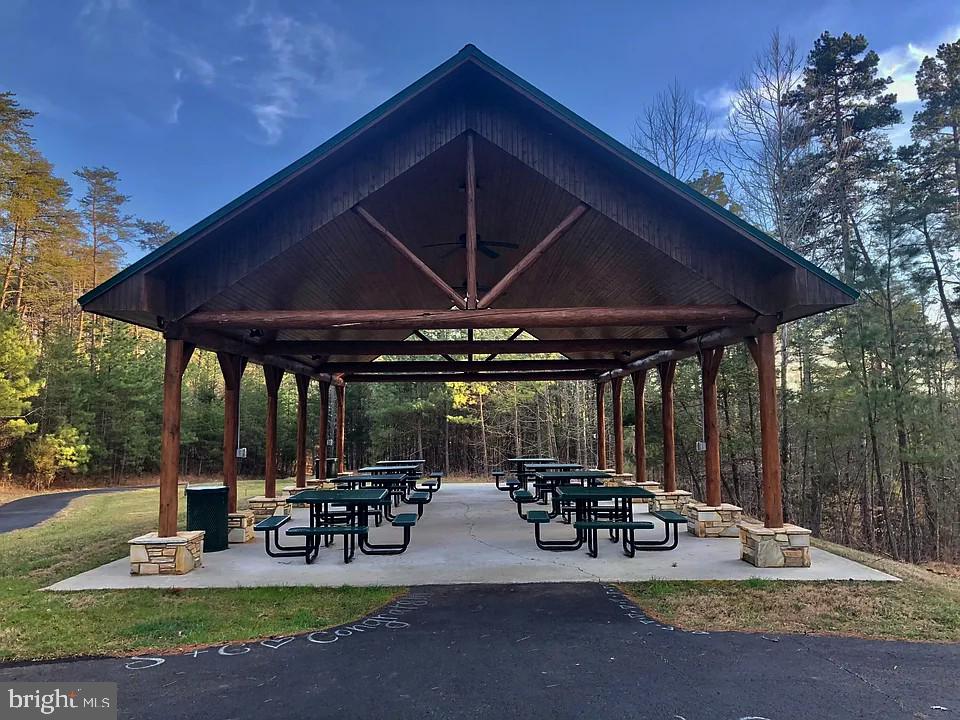 1180 Runaway Bay Road Lynch Station, VA 24571 - Photo 8 of 14 a view of a patio with table and chairs under an umbrella