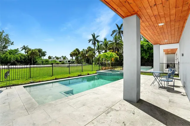 a view of a backyard with a garden and plants