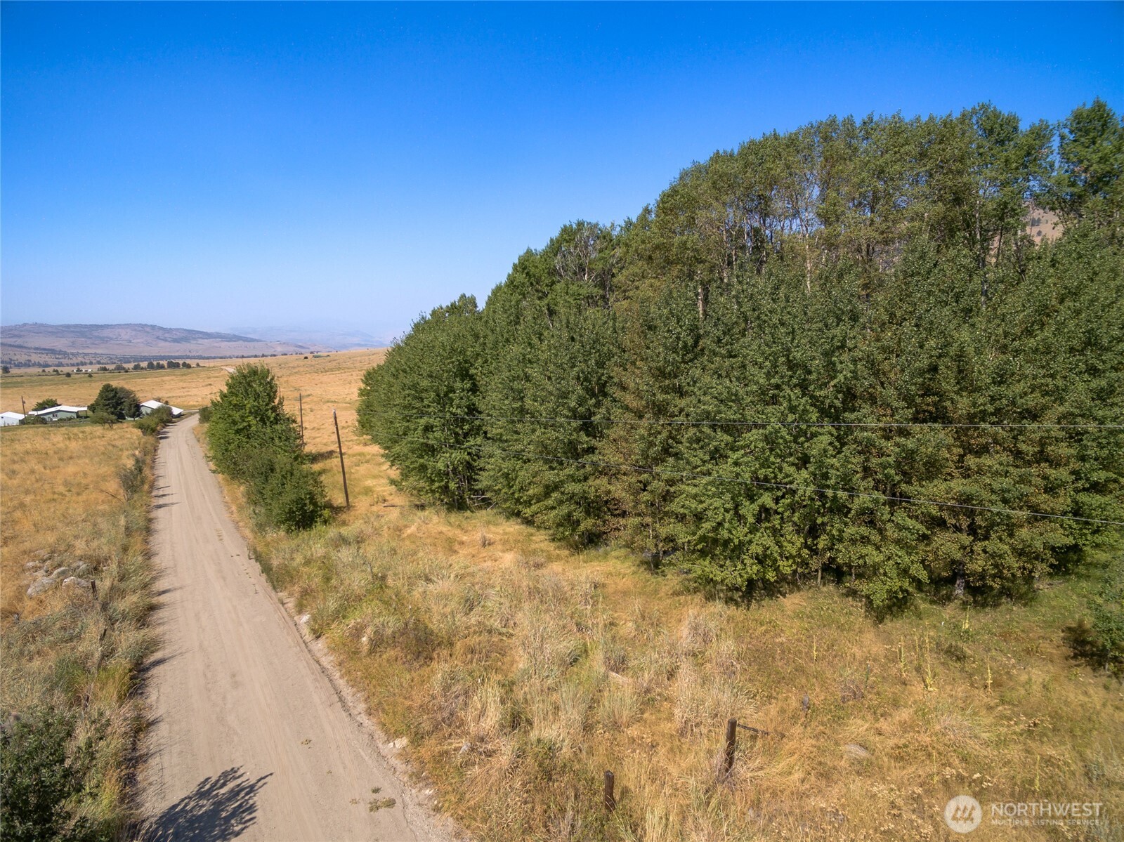 111 Fritz Road Riverside, WA 98849 - Photo 2 of 11 a view of a yard with a yard