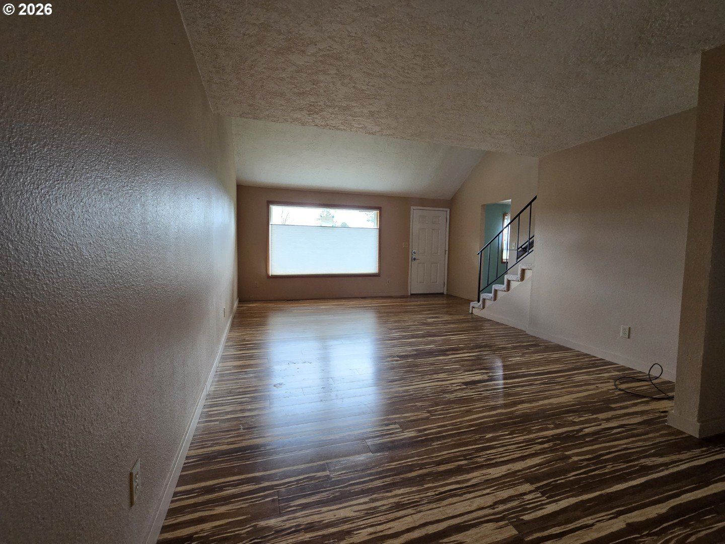 2633 42nd Avenue Longview, WA 98632 - Photo 11 of 32 a view of a room with wooden floor and window