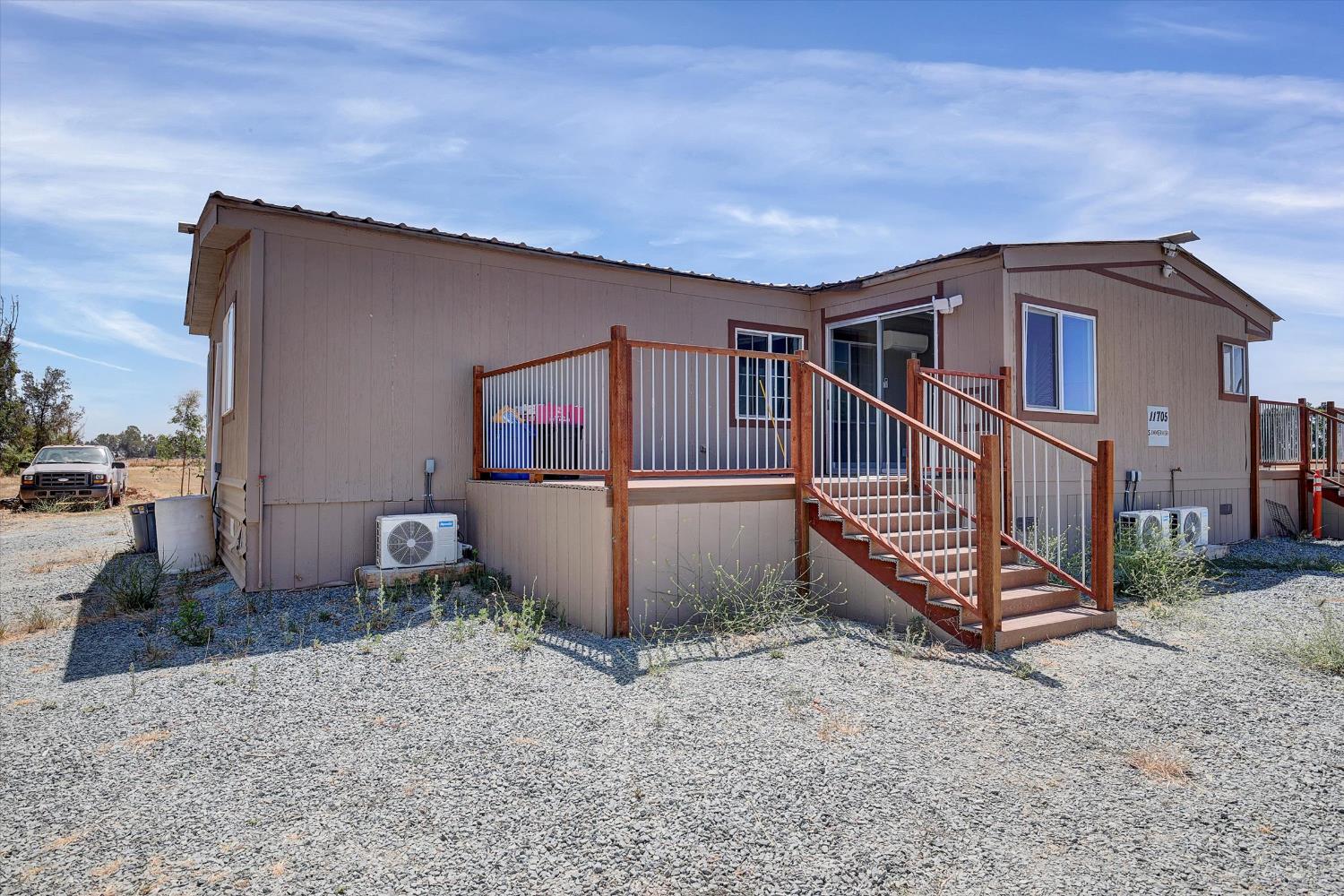 11705 Simmerhorn Road Galt, CA 95632 - Photo 25 of 39 a view of a house with a yard