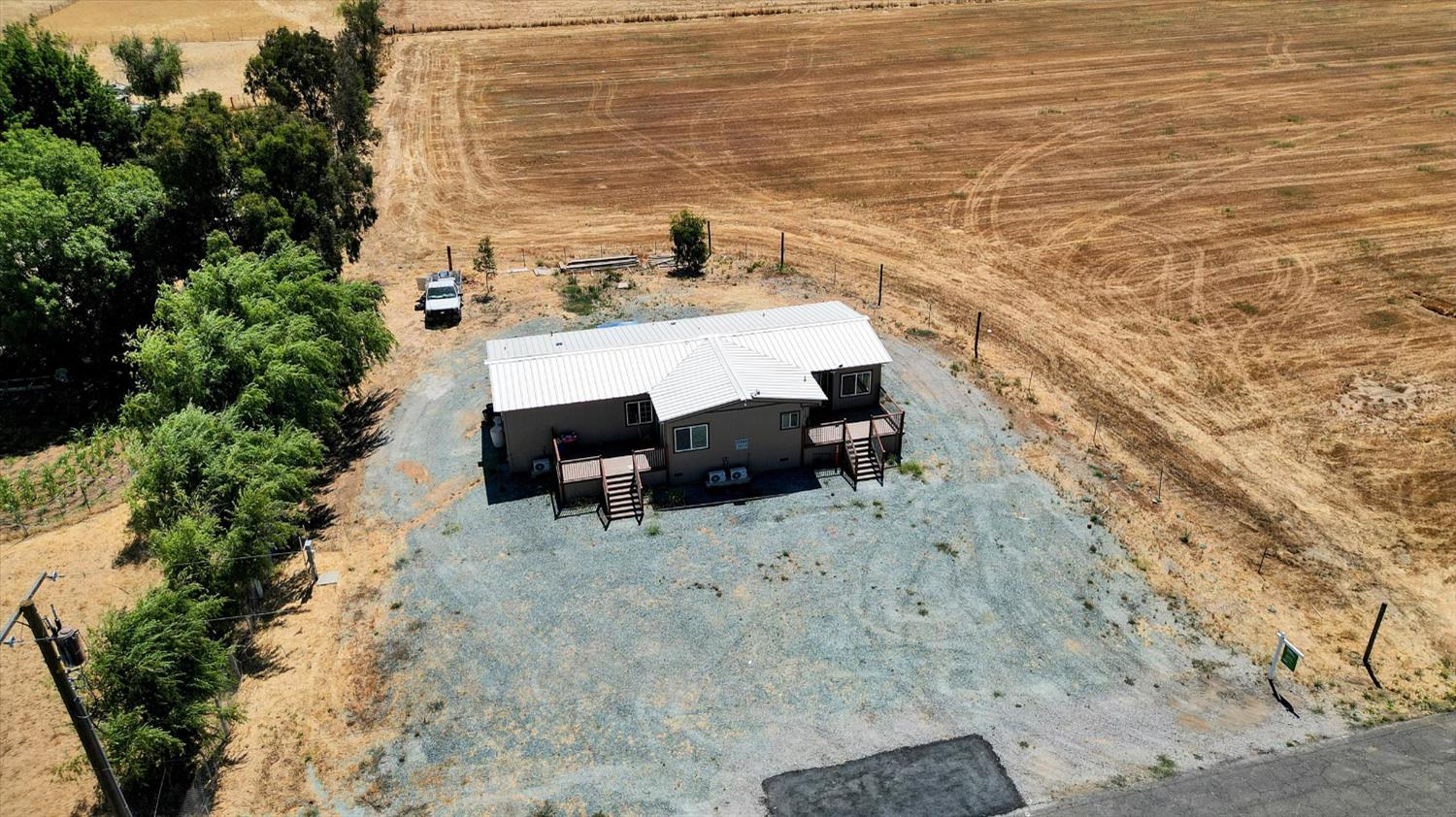 11705 Simmerhorn Road Galt, CA 95632 - Photo 29 of 39 a view of a terrace with chairs and potted plants