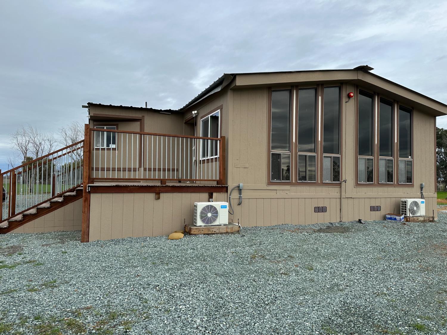 11705 Simmerhorn Road Galt, CA 95632 - Photo 5 of 39 a house with lots of trees in the background