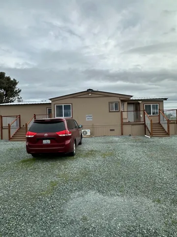 a view of a car in front of house