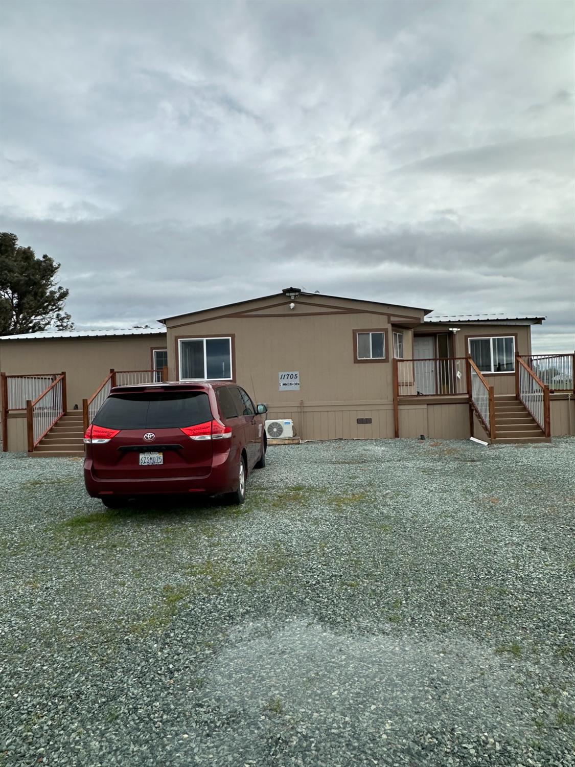 11705 Simmerhorn Road Galt, CA 95632 - Photo 6 of 39 a view of a car in front of house