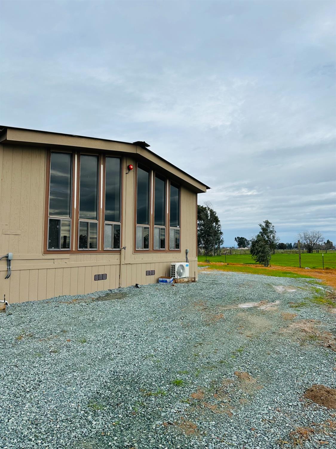 11705 Simmerhorn Road Galt, CA 95632 - Photo 7 of 39 a view of a house with a swimming pool and a yard