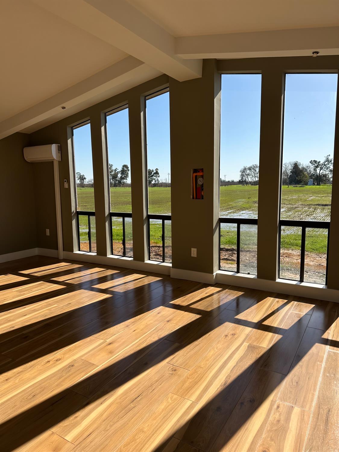 11705 Simmerhorn Road Galt, CA 95632 - Photo 8 of 39 a bedroom with a large bed and a large window