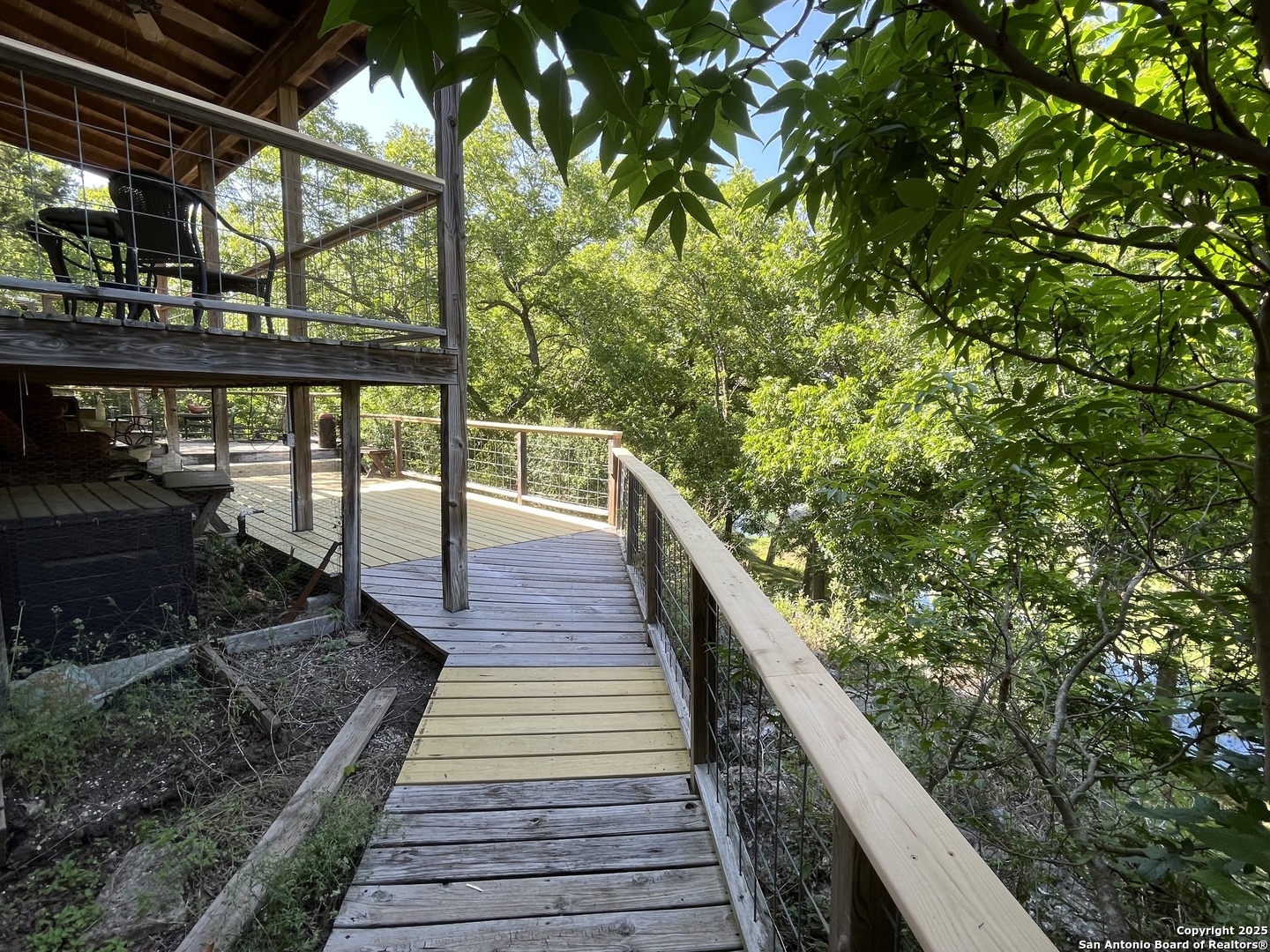 412 Field Road Fischer, TX 78623 - Photo 11 of 42 a view of balcony with wooden floor and fence