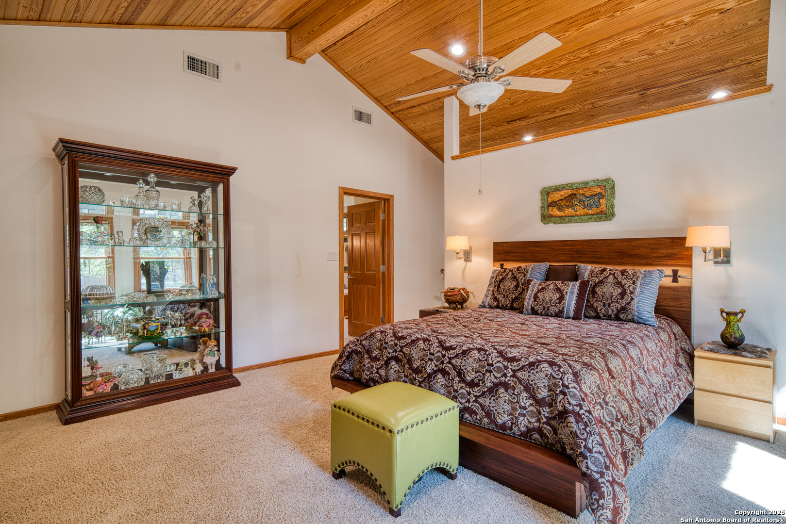 412 Field Road Fischer, TX 78623 - Photo 14 of 42 a bedroom with a bed and a ceiling fan