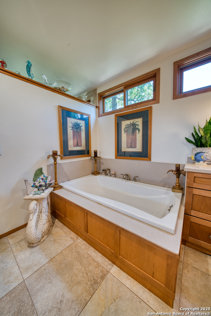 412 Field Road Fischer, TX 78623 - Photo 19 of 42 a spacious bathroom with a bathtub and a sink