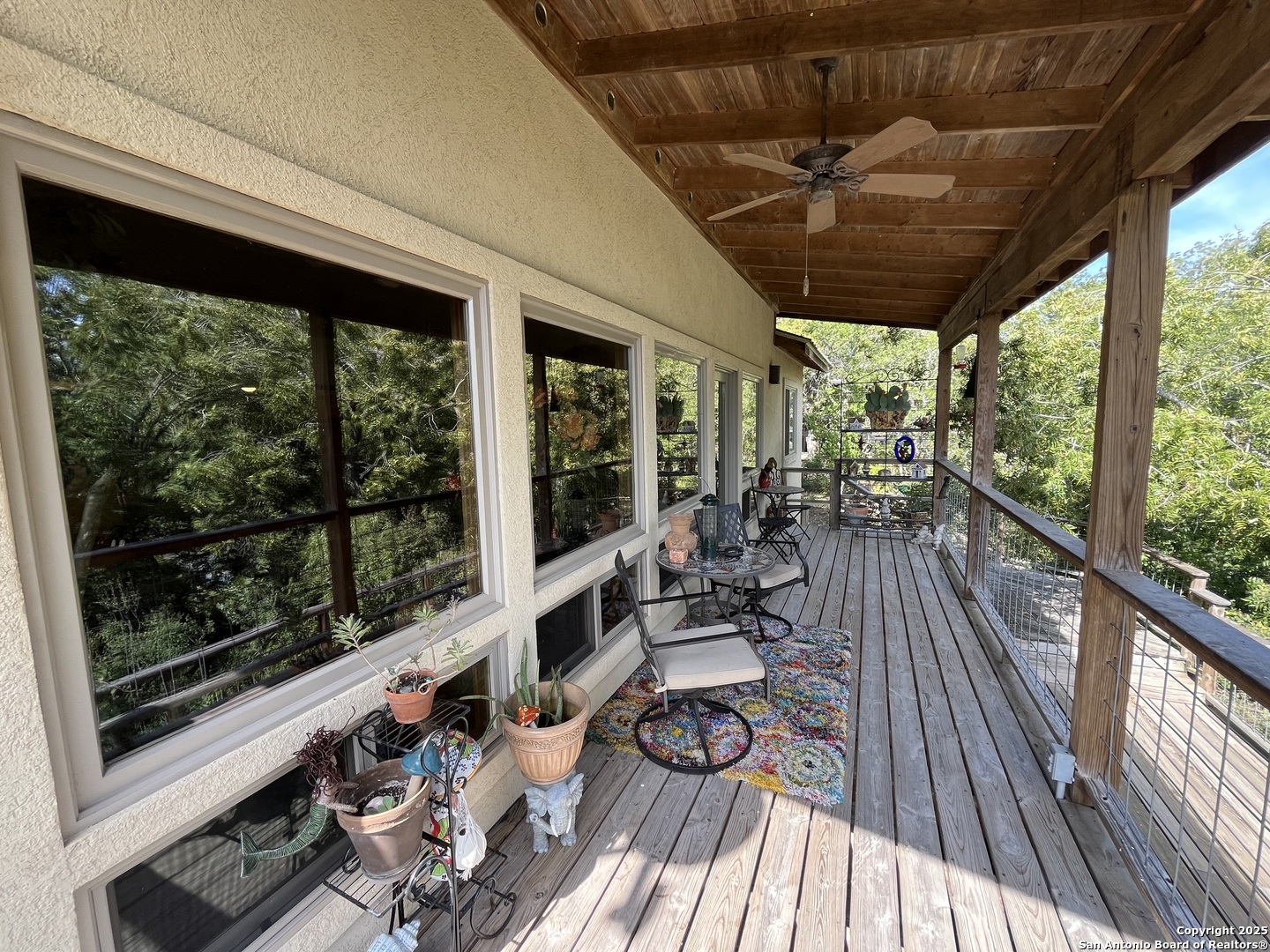 412 Field Road Fischer, TX 78623 - Photo 4 of 42 a view of a living room with furniture and floor to ceiling windows