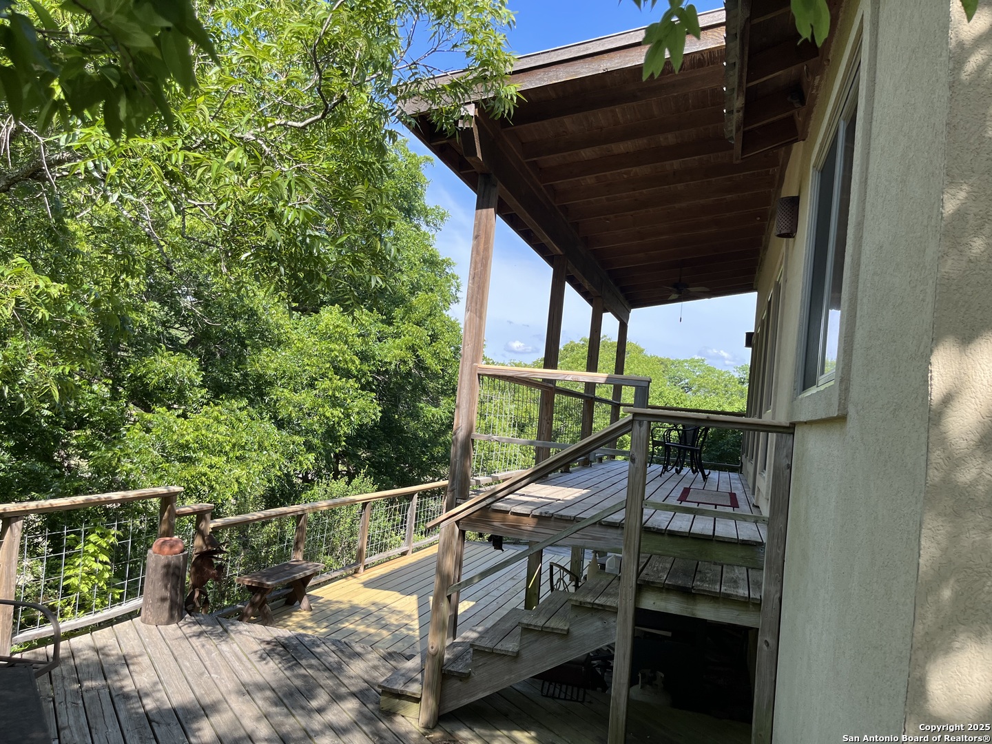 412 Field Road Fischer, TX 78623 - Photo 5 of 42 a view of balcony with wooden floor and outdoor seating