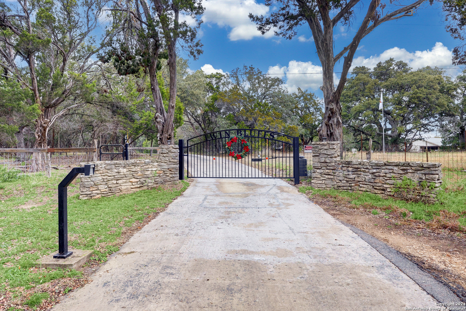 412 Field Road Fischer, TX 78623 - Photo 6 of 42 a view of a park with swings and a pathway