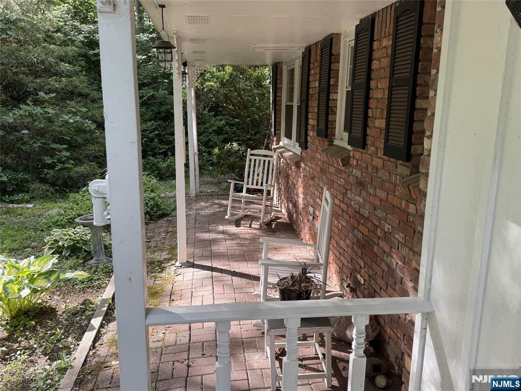 36 Lavina Trail Oak Ridge, NJ 07438 - Photo 2 of 26 a view of outdoor space with deck and furniture