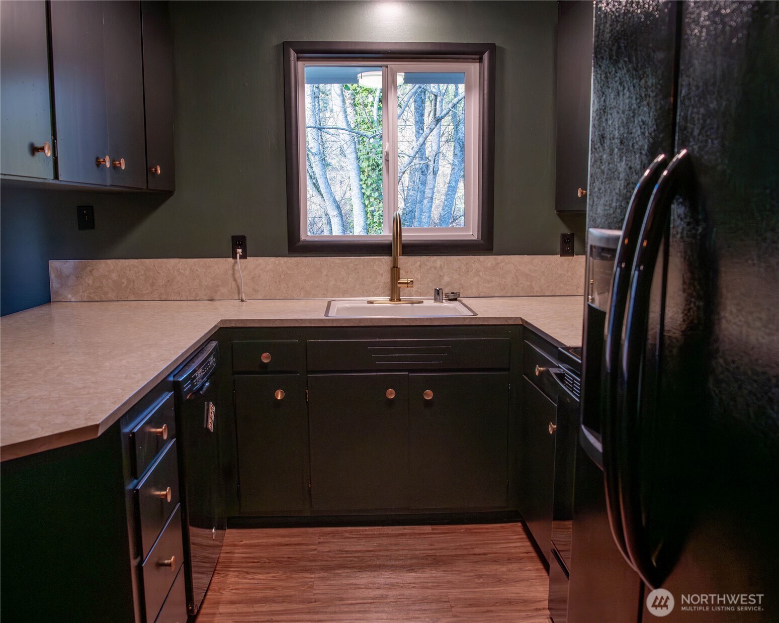116 Old Hill Road Aberdeen, WA 98520 - Photo 12 of 13 a kitchen with a sink a counter top space and cabinets