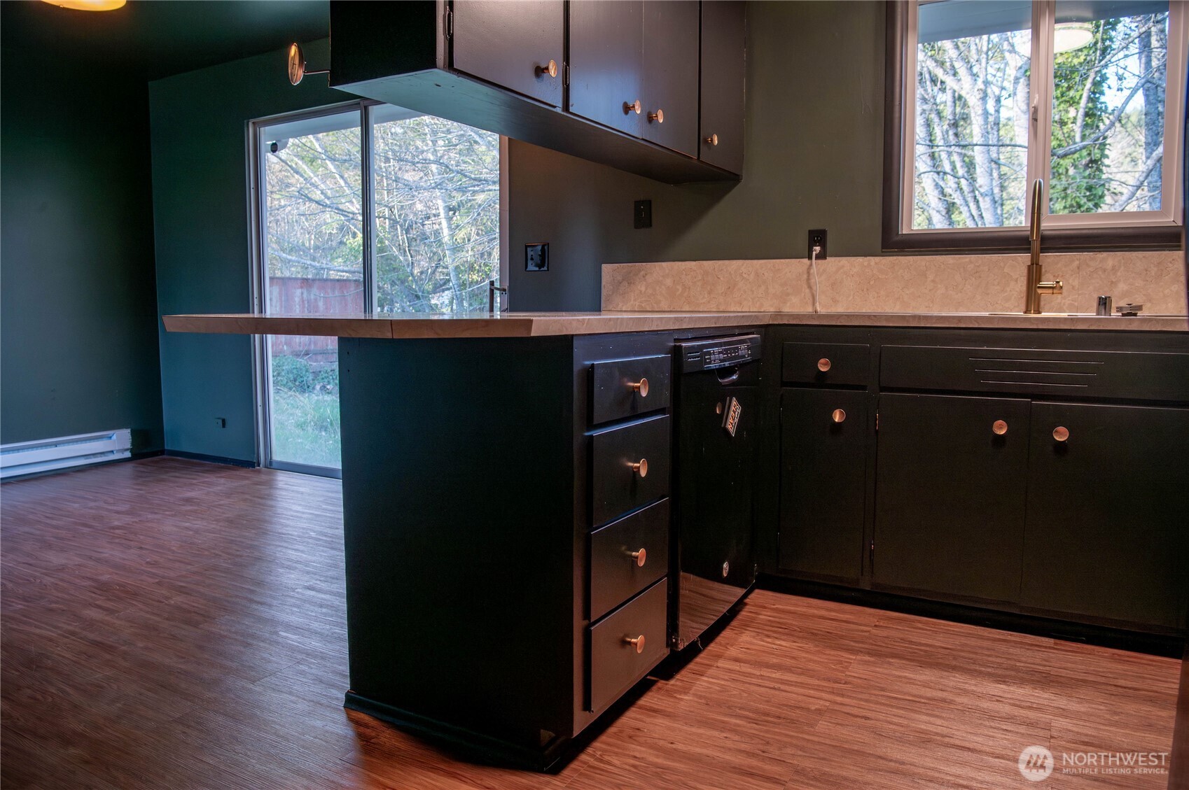 116 Old Hill Road Aberdeen, WA 98520 - Photo 13 of 13 a kitchen with stainless steel appliances granite countertop a refrigerator a sink dishwasher and wooden cabinets with wooden floor