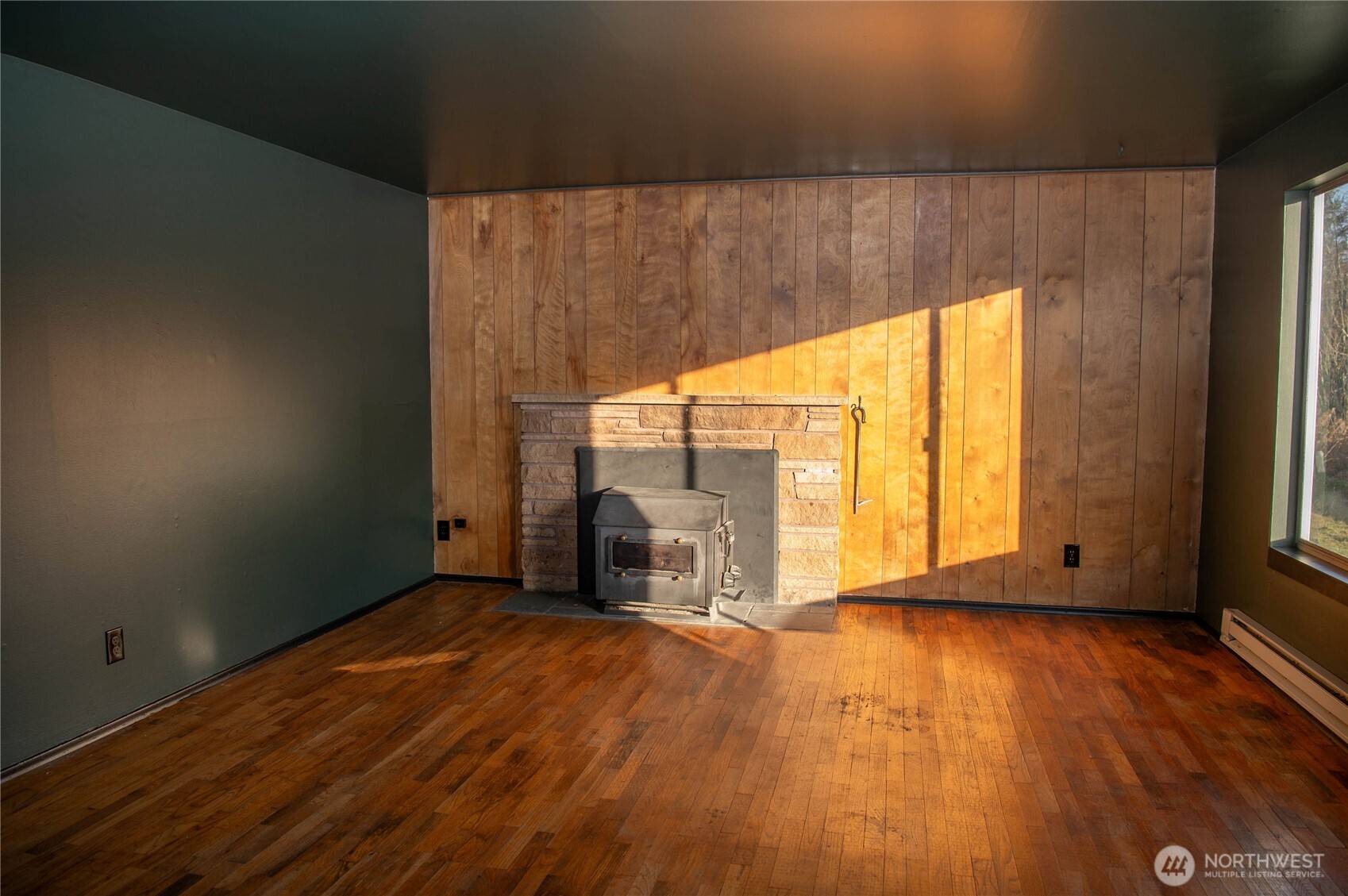 116 Old Hill Road Aberdeen, WA 98520 - Photo 2 of 13 a view of an empty room with a window and wooden floor