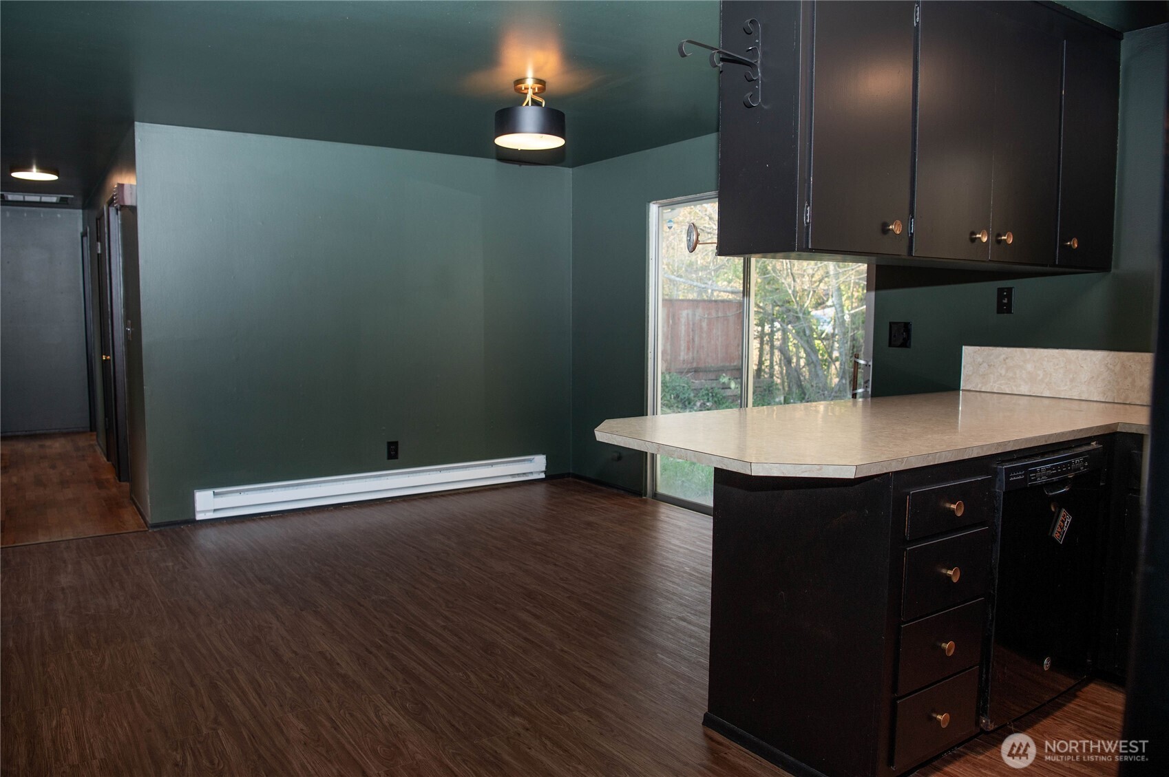 116 Old Hill Road Aberdeen, WA 98520 - Photo 3 of 13 a kitchen with a sink and cabinets