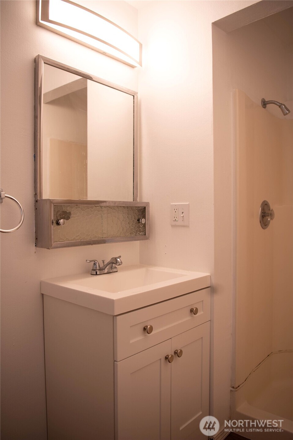 116 Old Hill Road Aberdeen, WA 98520 - Photo 7 of 13 a bathroom with a sink a mirror and a vanity