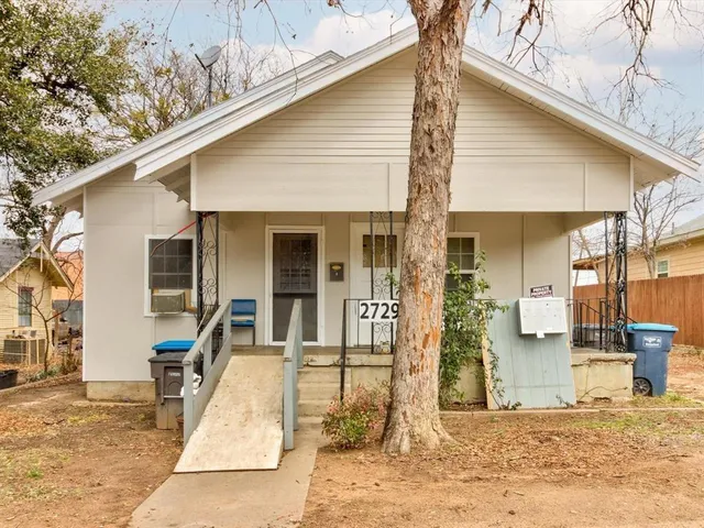 a front view of a house with a patio