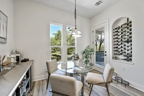 a dining room with furniture and window