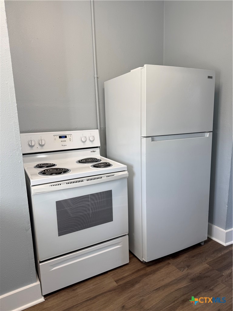 917 South 4th Street Temple, TX 76504 - Photo 11 of 30 a white refrigerator freezer sitting inside of a kitchen