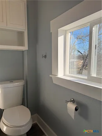 a bathroom with a sink vanity and a mirror