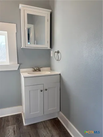 a bathroom with a toilet a sink and shower