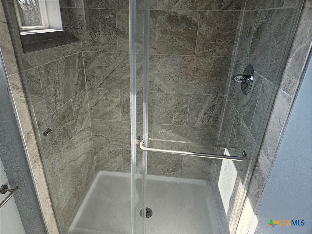 917 South 4th Street Temple, TX 76504 - Photo 19 of 30 a bathroom with a shower