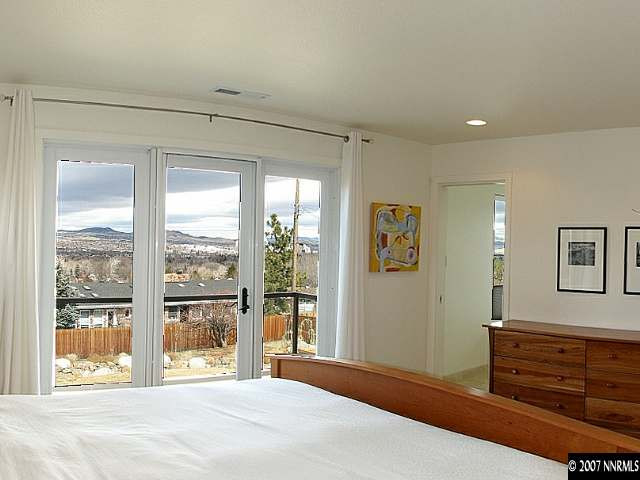 2175 Yuma Lane Reno, NV 89509 - Photo 5 of 9 a bedroom with furniture and large window