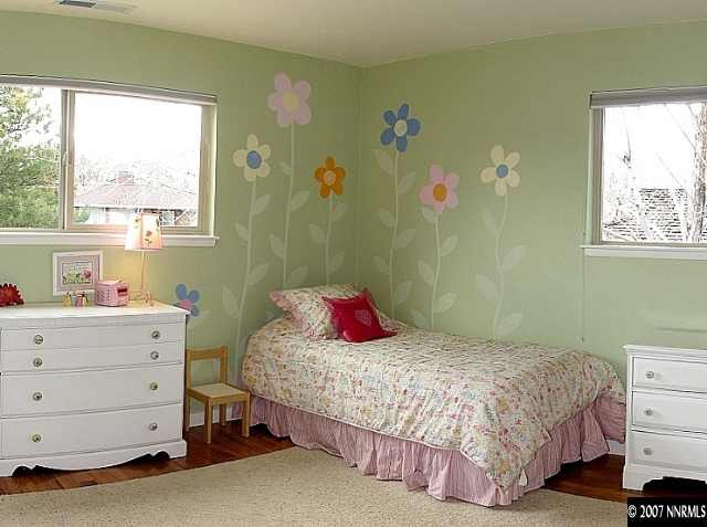 2175 Yuma Lane Reno, NV 89509 - Photo 7 of 9 a bedroom with a bed and a window
