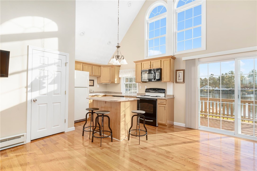 56 Raymonds Point Road Coventry, RI 02816 - Photo 6 of 24 Large windows to allow natural light in