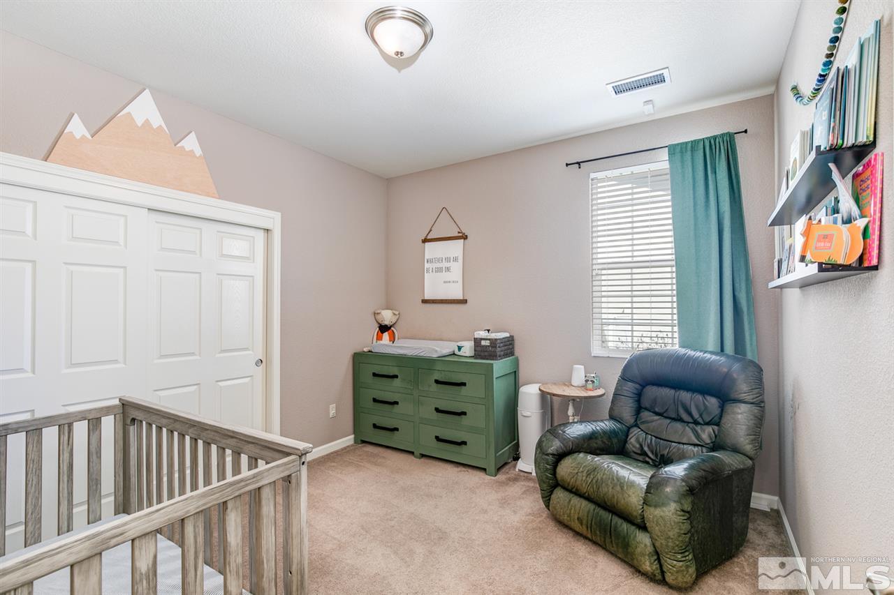 11057 Colton Drive Reno, NV 89521 - Photo 12 of 22 a room with furniture and a window