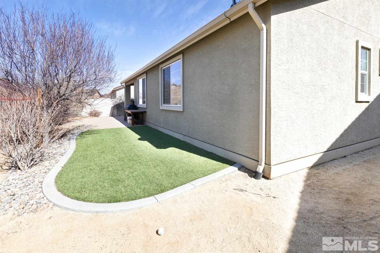 11057 Colton Drive Reno, NV 89521 - Photo 21 of 22 a view of a house with a backyard