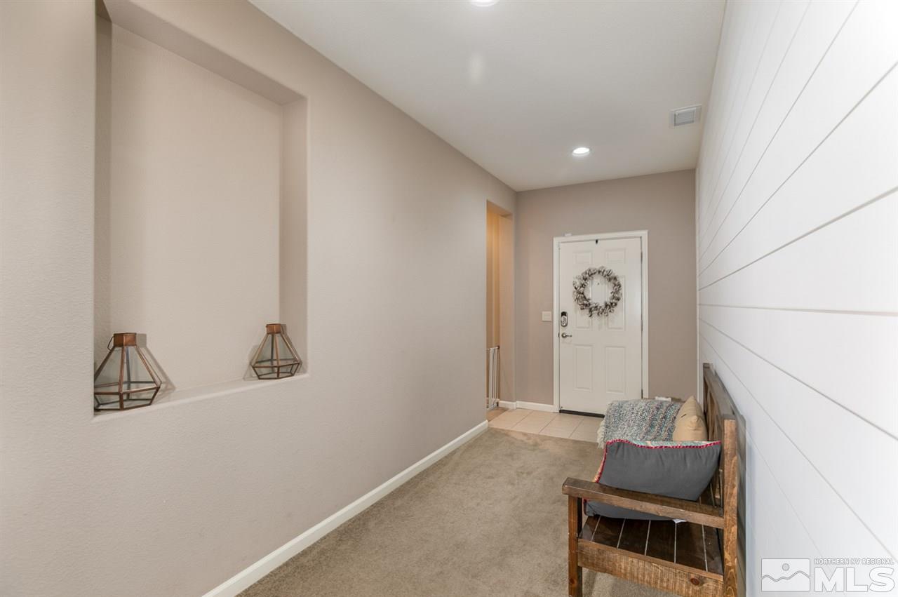 11057 Colton Drive Reno, NV 89521 - Photo 3 of 22 a room with furniture and mirror