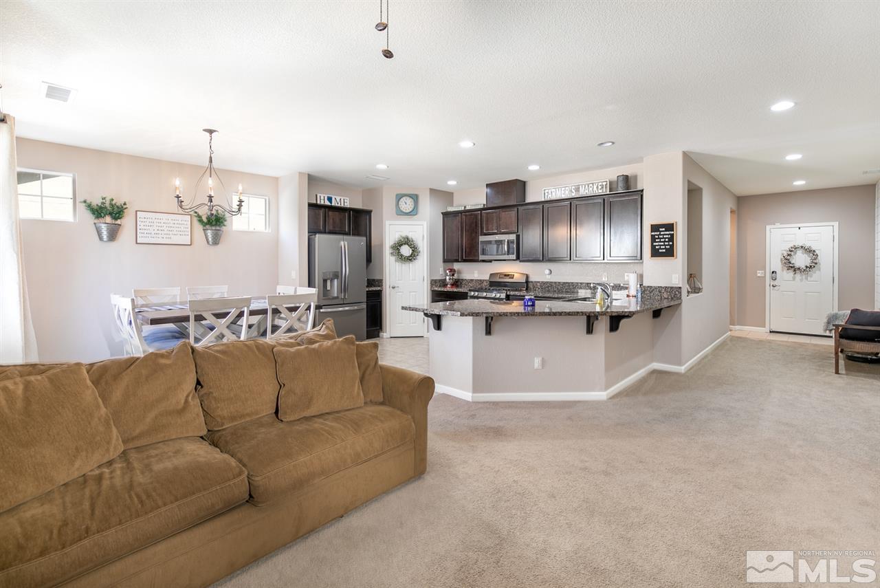 11057 Colton Drive Reno, NV 89521 - Photo 4 of 22 a living room filled with furniture and kitchen view