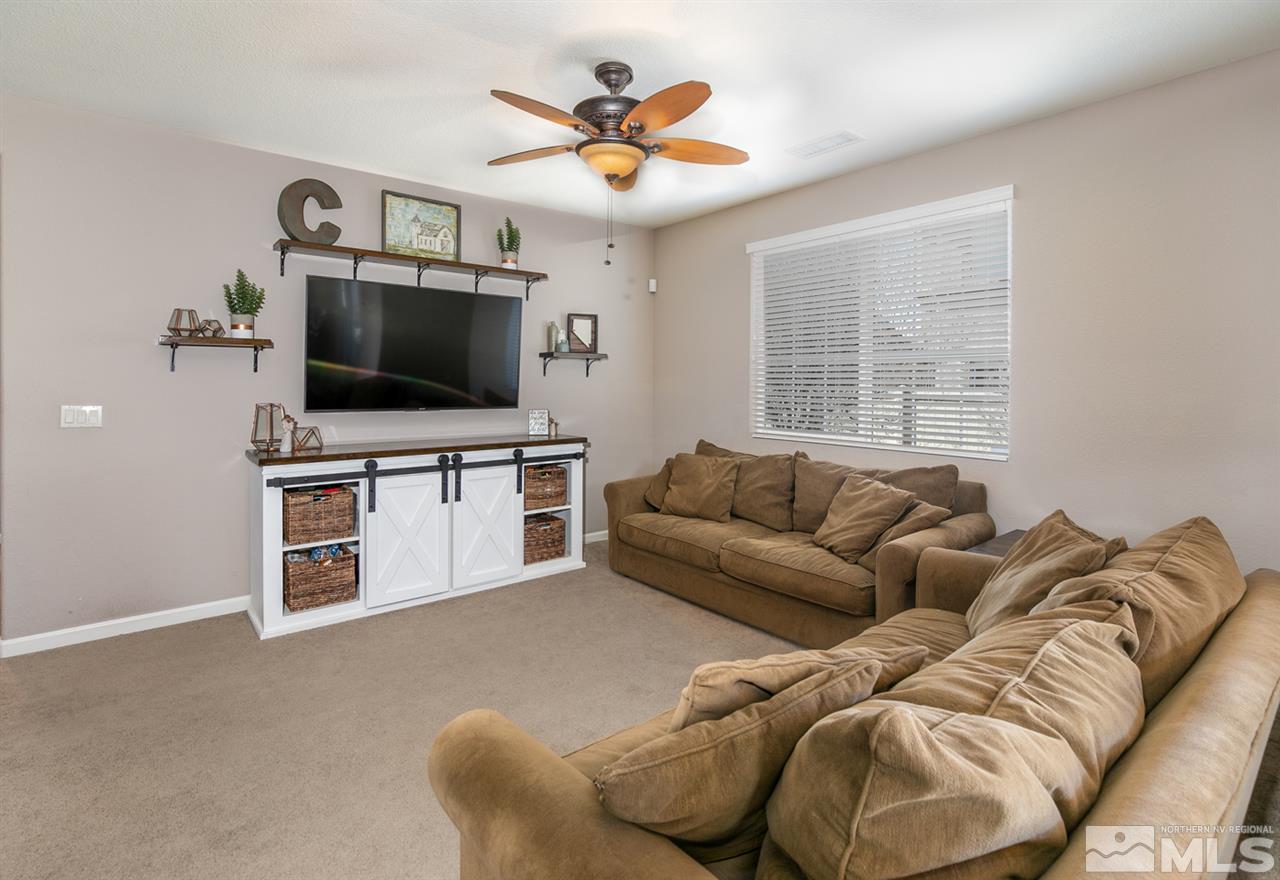 11057 Colton Drive Reno, NV 89521 - Photo 5 of 22 a living room with furniture and a flat screen tv