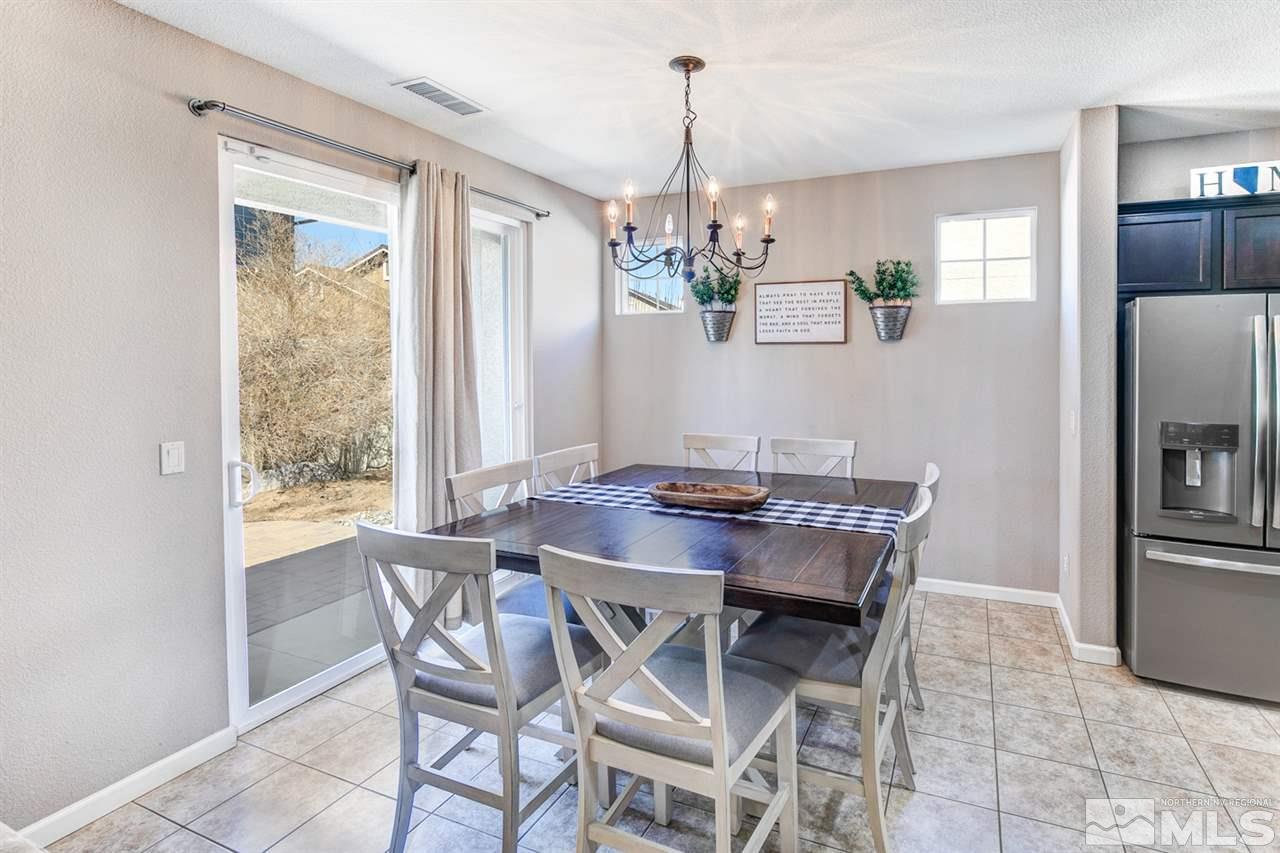 11057 Colton Drive Reno, NV 89521 - Photo 9 of 22 a view of a dining room with furniture window and wooden floor