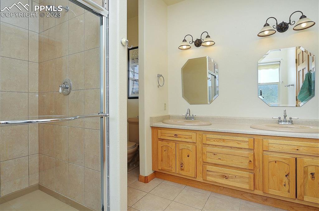 4330 Elkhorn Road Cotopaxi, CO 81223 - Photo 18 of 37 a bathroom with a double vanity sink and a mirror