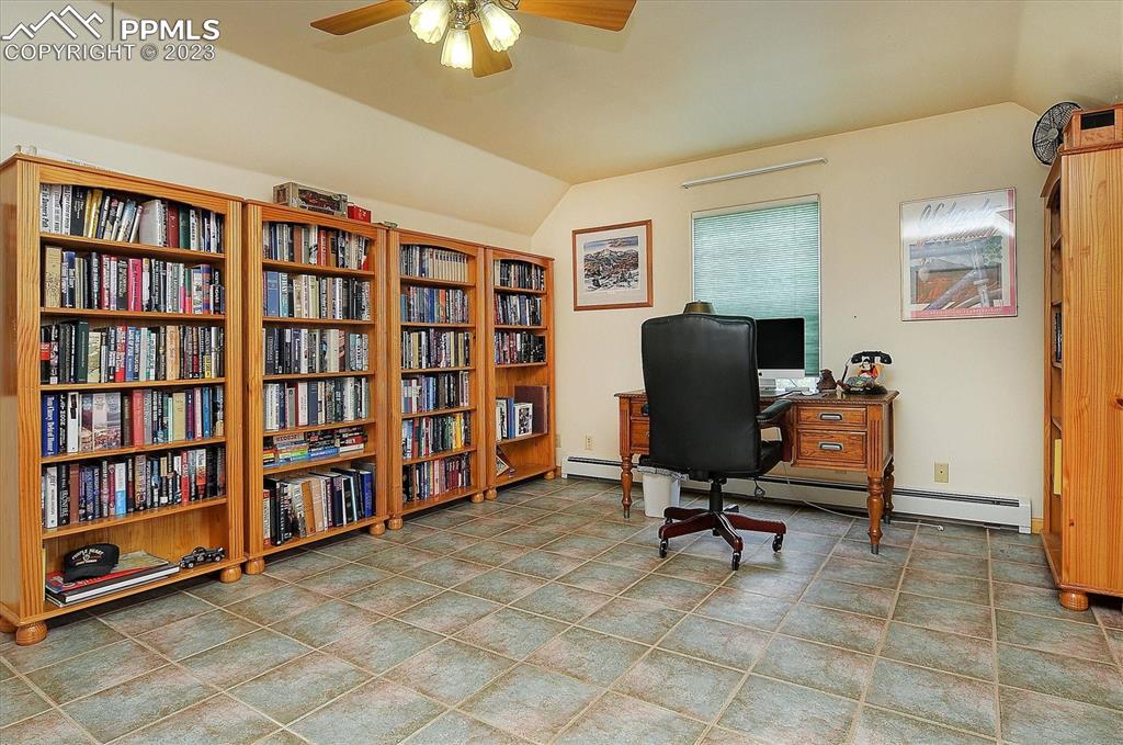 4330 Elkhorn Road Cotopaxi, CO 81223 - Photo 21 of 37 a view of a workspace with furniture and a bookshelf