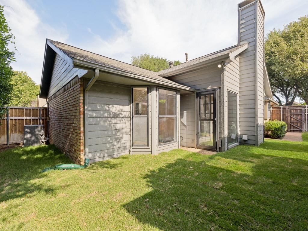 4010 Rive Lane Addison, TX 75001 - Photo 25 of 25 a front view of a house with a yard