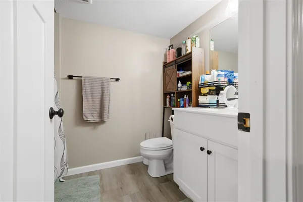 a bathroom with a toilet and a sink