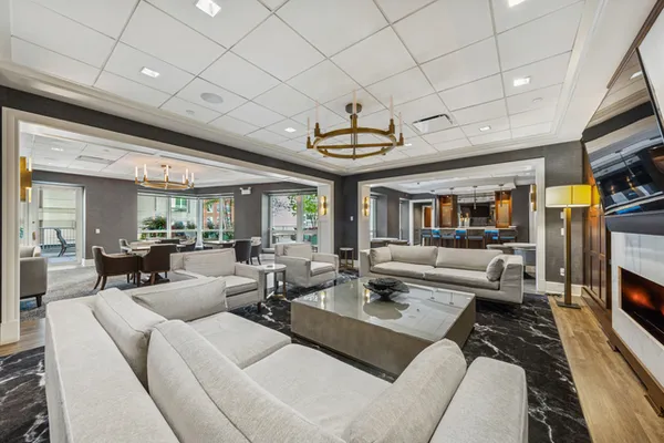 a living room with fireplace furniture and a flat screen tv