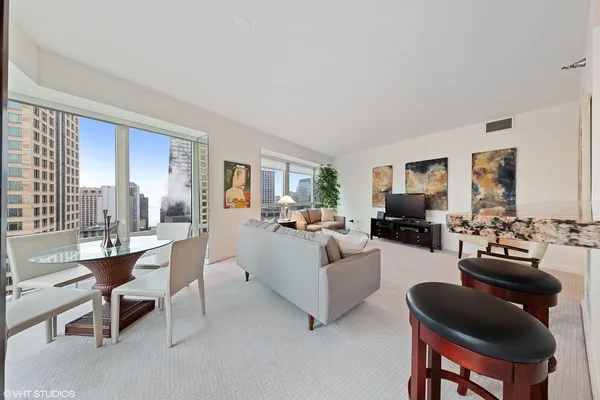 a living room with furniture and a large window
