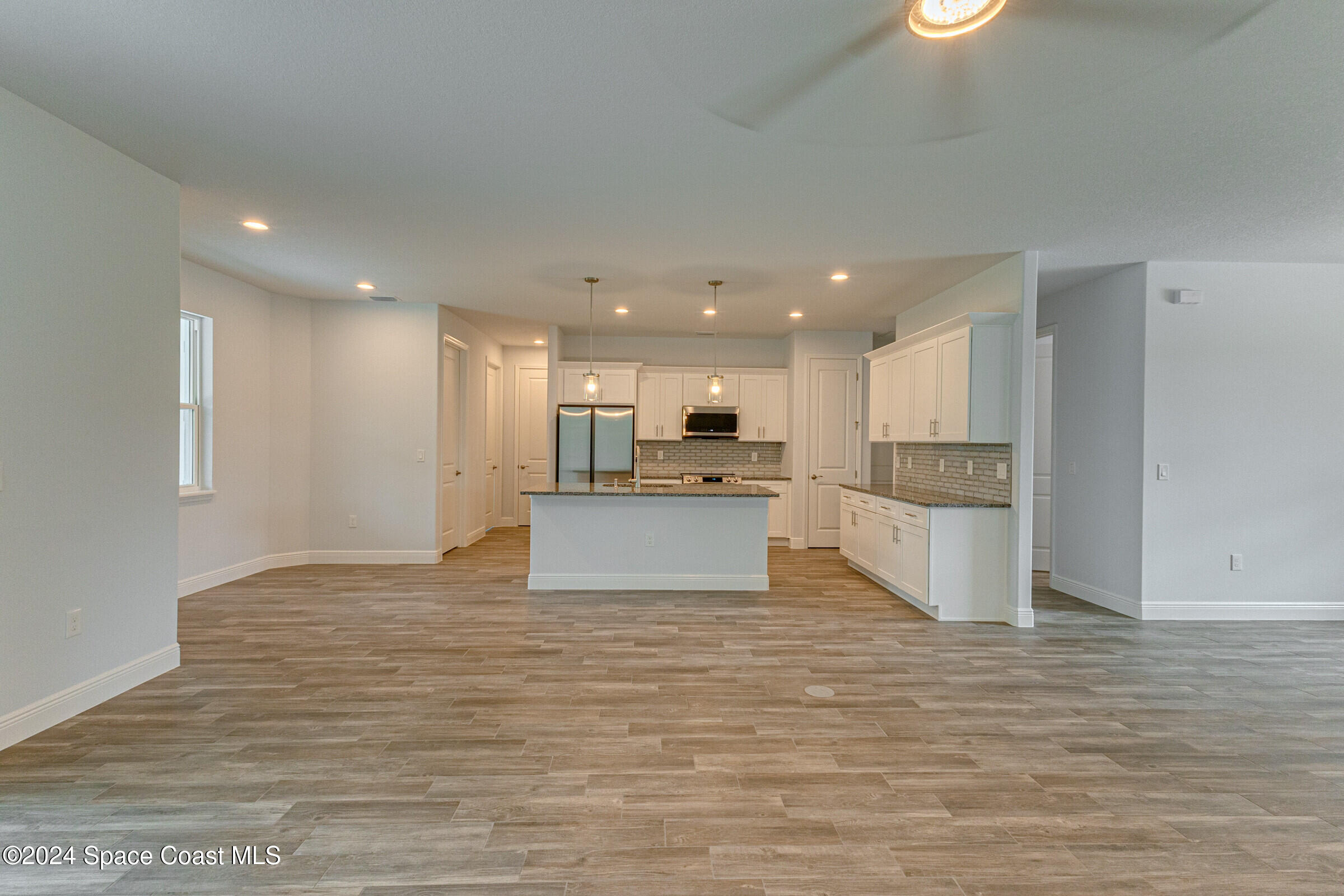 158 Deer Run Road Palm Bay, FL 32909 - Photo 10 of 10 a view of kitchen with kitchen island and stainless steel appliances
