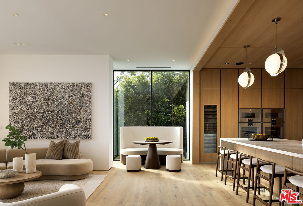 1660 Casale Road Pacific Palisades, CA 90272 - Photo 13 of 44 a living room with furniture and a large window