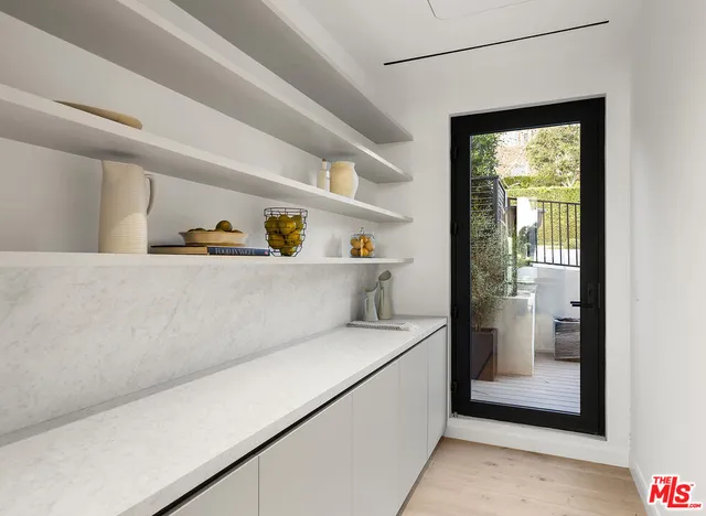 a bed room with a bed and a large window