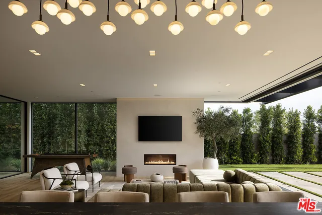 a living room with fireplace furniture and a flat screen tv
