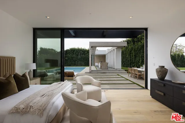 a view of living room with furniture and a potted plant