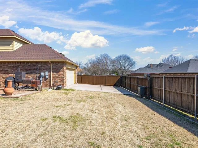 an aerial view of a house with swimming pool and lake view